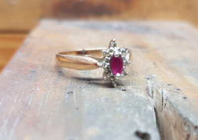 1. original ring. 18ct yellow and white gold set with diamonds and ruby